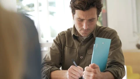 Man using laptop computer in co-working office Stock Footage 121456454