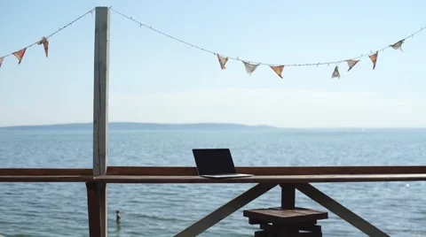Man using laptop computer at outdoor cafe Stock Footage 67103483