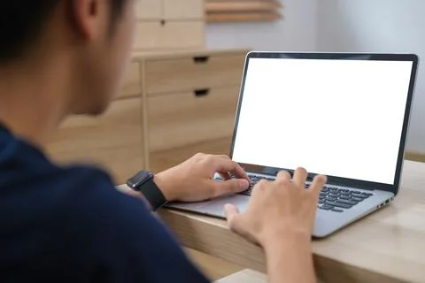 Man using laptop computer on table.. Foto stock