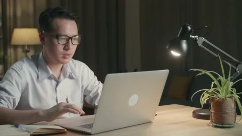 Man Using Laptop Computer Talk To Colleagues In Video Call While Working Stock Footage 154917568