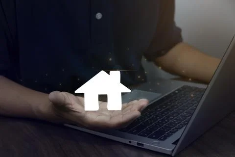 Man using laptop concept of real estate investing, buying a house, land pri.. Stock Photos