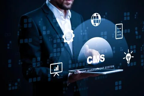 Man using laptop to display content management system with various icons in Stock Photos