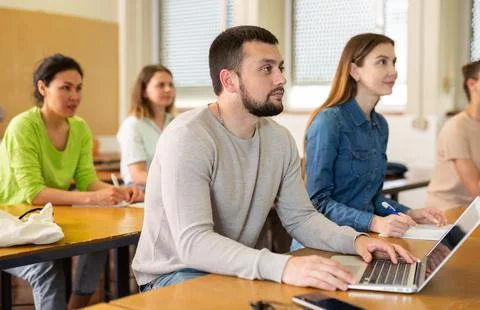 Man using laptop during lesson in university Foto stock