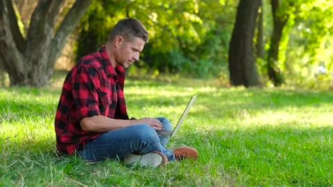 Man using laptop, freelancer working online outdoors, Stock Footage 161313522