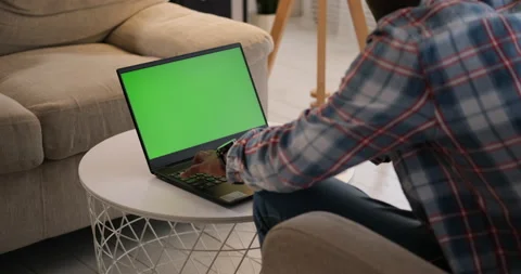 Man using laptop with green chroma key screen Video stock 144627791