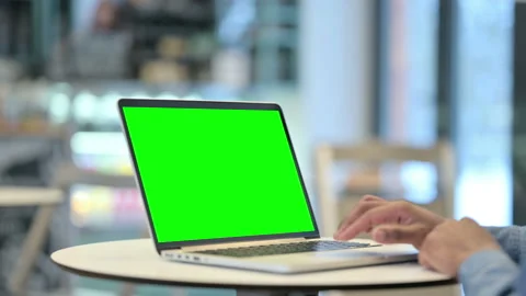 Man Using Laptop with Green Chroma Key Screen, Close Up Stock Footage 146484330