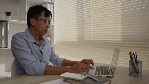 Man using laptop, Hand pressing on laptop keyboard, Work from the comfort of Stockbeeldmateriaal 263477853