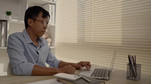 Man using laptop, Hand pressing on laptop keyboard, Work from the comfort of Stockbeeldmateriaal 263478102