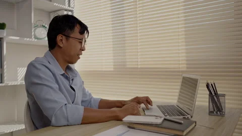 Man using laptop, Hand pressing on laptop keyboard, Work from the comfort of Stockbeeldmateriaal 263478106