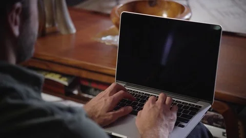Man using laptop at home Stock Footage 83185078