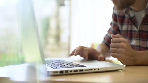 Man using laptop at home Stock Footage 106296348