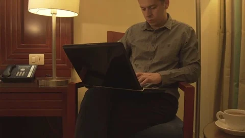 Man using laptop in home interior. Stock Footage 73999456