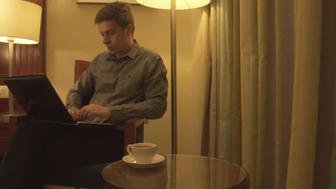 Man using laptop in home interior. Stock Footage 73999651