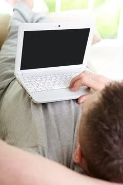 Man using laptop in home Stock Photos