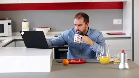 Man using laptop in kitchen. Stock Footage 109397930