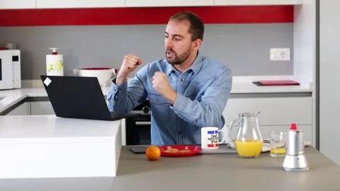 Man using laptop in kitchen. Stock Footage 109397943