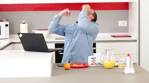 Man using laptop in kitchen. Stock Footage 109397970