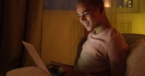 Man using laptop late night at home Stock Footage 145294791