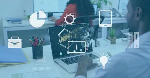 Man using laptop in office, using touchpad, sharing NFT on call with animated Stock Photos