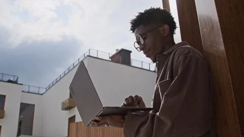 Man Using Laptop Outside Stock Footage 320007208