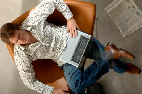 Man using laptop, overhead view Stock Photos