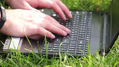 Man Using Laptop park Stock Footage 70793434