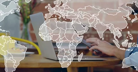 Man using laptop, phone at cafe, world map fading in overlaying table to show Stock Footage 334114427