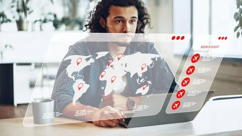 Man using laptop to plan travel and book flights with a digital interface Stock Photos
