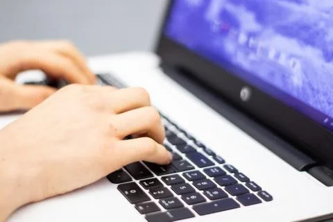 Man using laptop, searching web, browsing information, Stock Photos