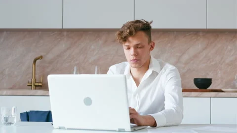 Man using laptop speaking on phone. Stock Footage 209184605