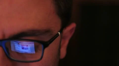 Man using a laptop to surf on facebook Stock Footage
