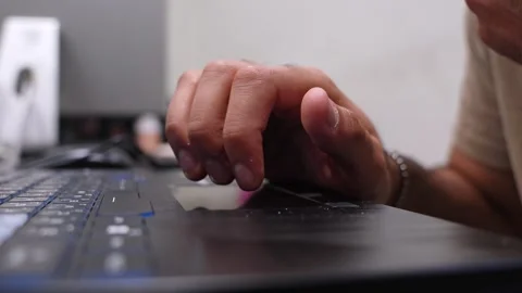 Man Using Laptop Trackpad in Modern Office Stock Footage 335966793