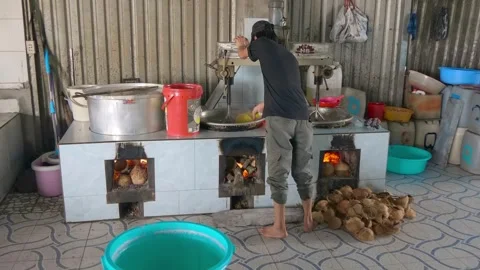 Man is using large specialized mixer for making traditional Vietnamese sweets Stock-Footage 333365971