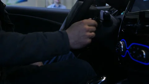 Man using large touchscreen dashboard in car, testing new vehicle functions Stock Footage 89995474