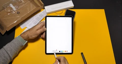 Man using latest iPad Pro digital Tablet drawing in notes app Video stock 100818110
