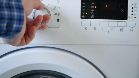 Man Using Laundry Machine Set Programm Temperature Level and Push Start Button Vidéo 123404333