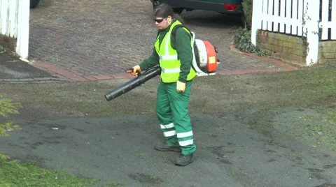 Man using leaf blower Stock Footage 36690821