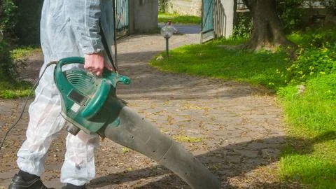 Man using a leaf blower Stock Photos