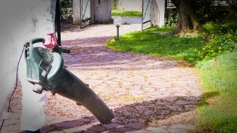 Man using a leaf blower Stock Photos