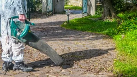 Man using a leaf blower Stock Photos