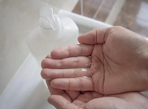 Man using liquid soap Stock Photos