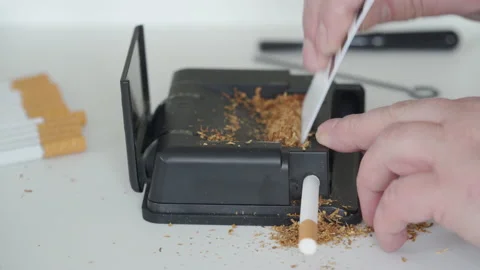 cigarette rolling machine video How to Roll a With a Cigarette Roller: 10 Steps Watch Electric Cigarette Rolling Machine,