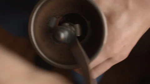 Man using manual coffee grinder 動画素材 220249850
