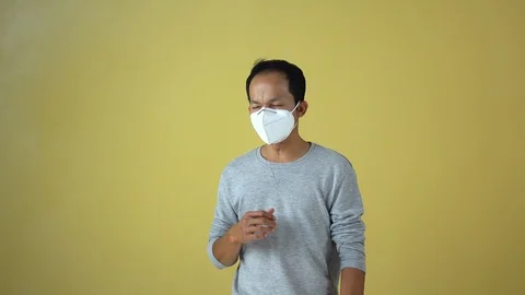 A man using a mask for protect an air toxic.  Stock Footage 123778398