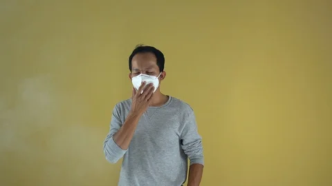 A man using a mask for protect an air toxic.  Stock Footage 123778608