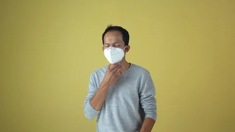 A man using a mask for protect an air toxic.  Stock Footage 123778611