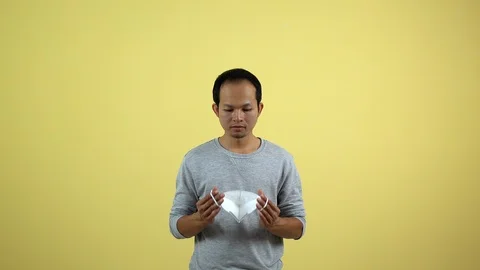 A man using a mask for protect an air toxic.  Stock Footage 123778647