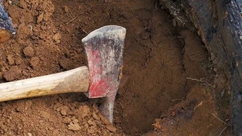 Man Using Mattock/Pick Axe on Solid Dirt Stock Footage 115052660
