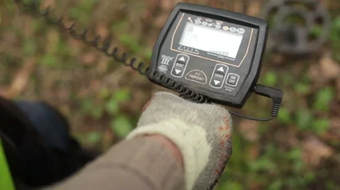 Man using metal detector in field Stock Footage 58644452