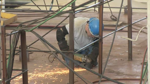 Man Using a metal Grinder Stock Footage 24465608